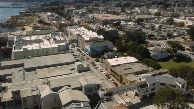 Aerial flying over the Cannery Row and the Monterey Bay Aquarium. Monterey, California, USA. 25 April 2019