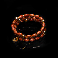 beads necklace on black background