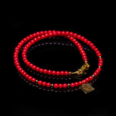 beads necklace on black background