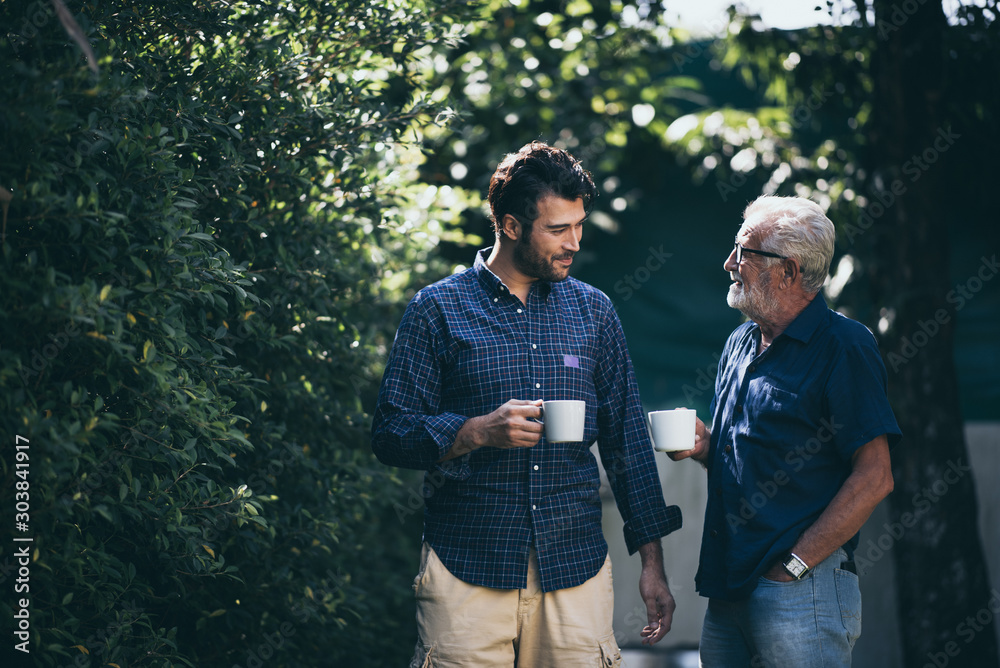 Wall mural happy father and son with coffee cup