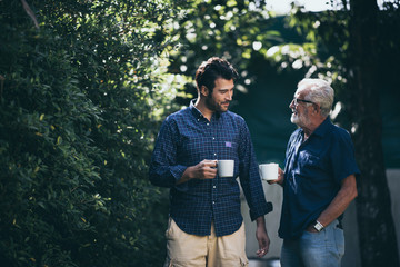 Happy Father and son with coffee cup - Powered by Adobe