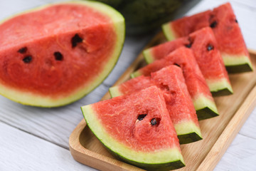 Fresh watermelon slices on wooden