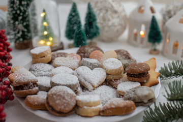 Christmas table scene of assorted sweets and cookies