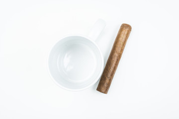 Gorgeous cigar from twisted sheets in mug with white background.