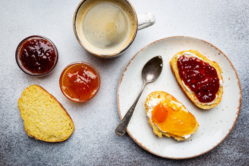 Sandwich with various sweet fruit jams and cottage cheese on light background, top view with copy space