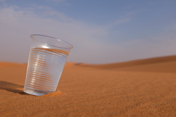 Glass of water on a desert. Drink water regularly. 