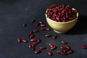 red healthy beans on a dark gray  background