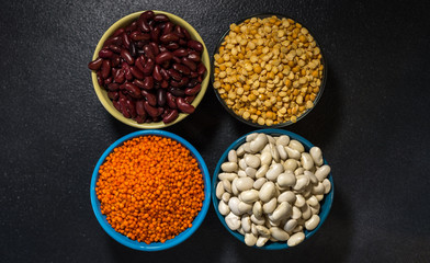  healthy eating vegetarian beans lentils and peas on a dark background