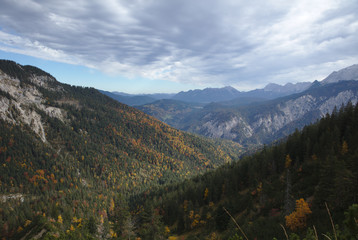 NB__9784 Clouds above mountain range with forest in autumn