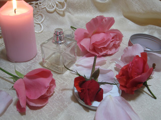 pink and red roses and christmas candles on white background