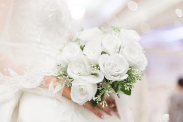 closeup of bride hands holding beautiful wedding bouquet