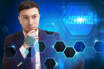 Business, Technology, Internet and network concept. Young businessman working on a virtual screen of the future and sees the inscription: Affiliate marketing