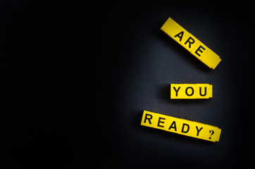 Are You Ready word on the black background with free place for your text.
