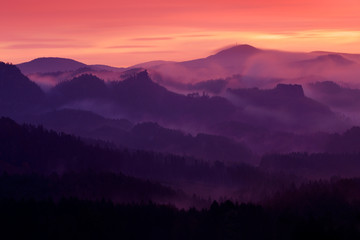 Twilight morning landscape. Cold misty foggy morning with sunrise in a fall valley of Bohemian...