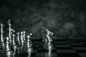 Gold and Silver Chess on chess board game for business metaphor leadership concept