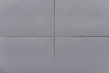 old gray concrete wall with cracks and putty stains.Background.