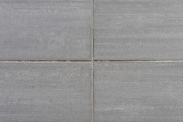 old gray concrete wall with cracks and putty stains.Background.
