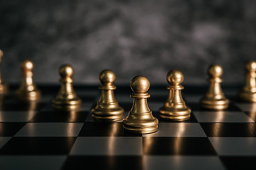 Gold Chess on chess board game for business metaphor leadership concept