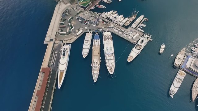 Aerial panoramic view of cityscape of Monte Carlo, yachts in harbour, landscape panorama of Monaco from above, Europe