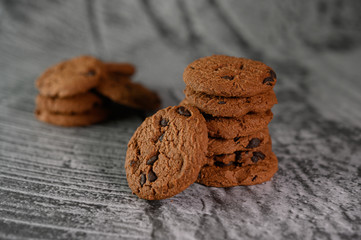 A pile of cookies on a wooden table