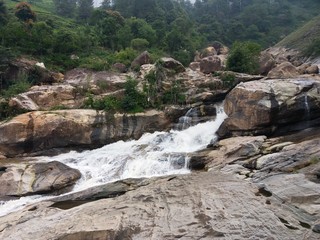 Fototapeta na wymiar waterfall in the mountains river