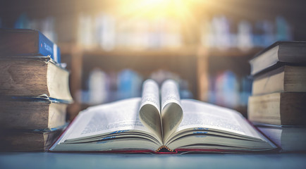 Stack of books in the library and blur  background