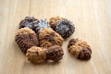 Cinnamon sandbakelse christmas cookies, two color, cocoa dark brown and vanilla light golden brown, delicious cookies