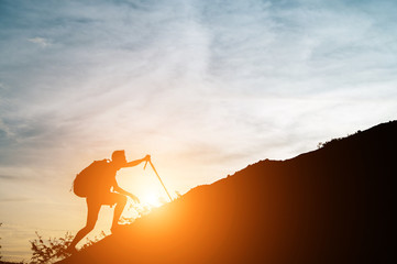 One man walked up the hill with his cane.