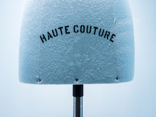 Haute Couture signage on mannequin made from fine luxury garment textile in luxury fashion store...