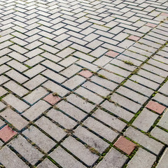 Street with stone paving stones. Cobble stone blocks as background.