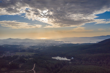 beautiful top view of the city near the ocean at sunset