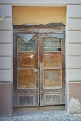 Old dirty brown wooden house door broken