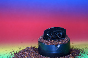 Sumac spice with macro lens photographed against colorful gradient in studio