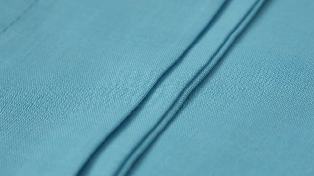 Blue fine cotton sheets details 4K panning video