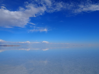 Beautiful mirror reflection on blue sky and cloud at Salar de Uyuni, Salar de Uyuni is the world's largest salt flat, Bolivia