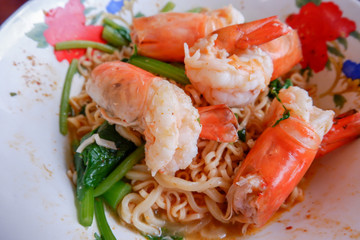 Prawns on spicy instant noodle.