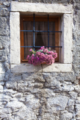 flowers on stone window