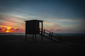 Fototapeta na wymiar beach hut at sunrise on playa blanca beach, puerto del carmen, lanzarote.