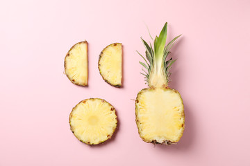 Flat lay with pineapple on pink background, space for text