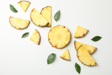 Flat lay with pineapple slices on white background, space for text