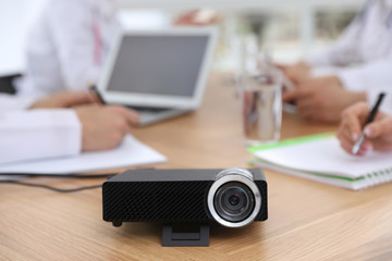 Video projector on table during medical conference