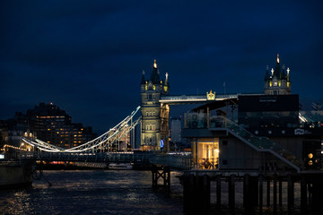 LONDON, UK - NOV 13, 2019: Tower Bridge is a combined bascule and suspension bridge in London, built between 1886 and 1894. The bridge crosses the River Thames close to the Tower of London.