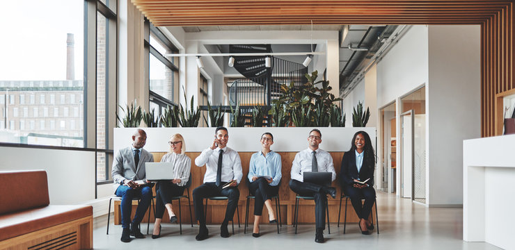 Diverse businesspeople working in the reception area of an offic