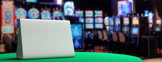 Blank metal sign on a casino table, blur slot machines background. 3d illustration