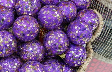 Purple christmas balls with sparkles. New Year's decor.
