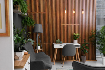 Stylish room interior with beautiful plants. Home design idea