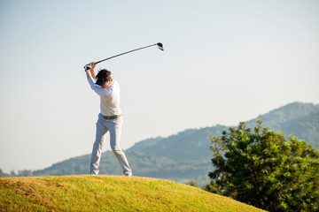 golfer  hit sweeping ball