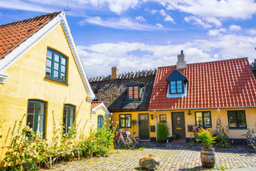 Small streets with beautiful, yellow old houses. Traditional Scandinavian houses.Dragor, Denmark. Architecture.