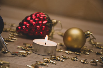 christmas still life with candle and decorations