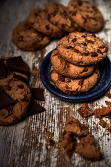 group of tasty cookies next to a bowl